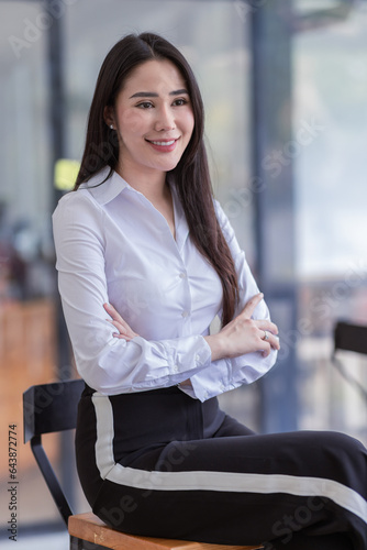 Portrait of successful business asian women arms crossed and smile dressed casually with happy and self-confident positive expression isolated over office background Free Download Portrait of successful business asian women arms crossed and smile dressed casually with happy and self-confident positive expression isolated over office background - GFXLoad