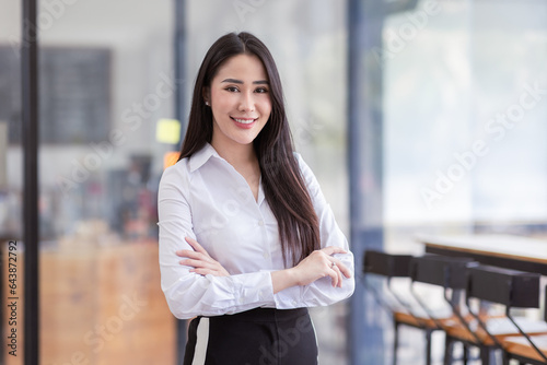 Portrait of successful business asian women arms crossed and smile dressed casually with happy and self-confident positive expression isolated over office background Free Download Portrait of successful business asian women arms crossed and smile dressed casually with happy and self-confident positive expression isolated over office background - GFXLoad