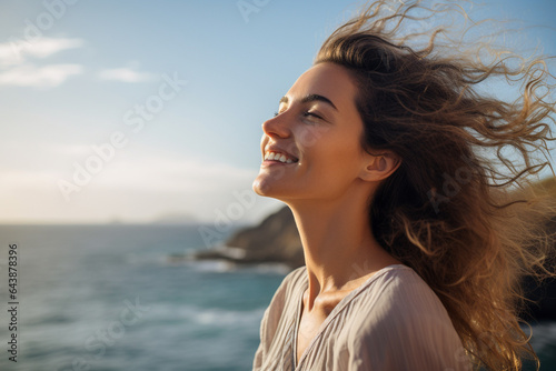 happy young woman with backpack looking to the sky © toonsteb