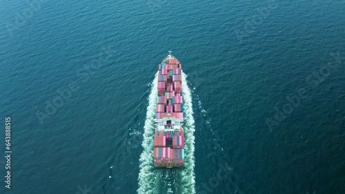 4K resolution high angle view of a container ship sailing at the sea for transportation.