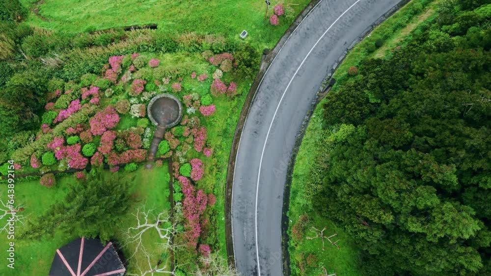 Curved road crossing grassy hills drone top view. Highway at asphalt mountain Curved road crossing grassy hills drone top view. Highway at asphalt mountain