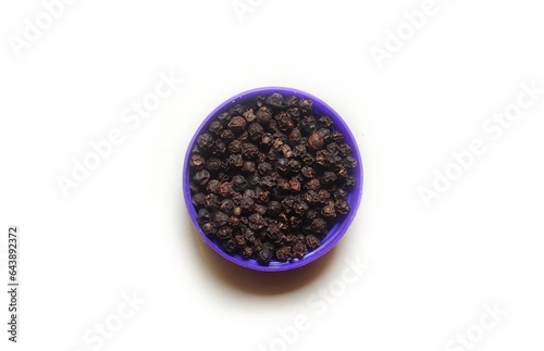 Black Peppercorns are dry seeds of flowering vine Piper nigrum. It is used as a spice and for seasoning. It is native to the Malabar Coast of India and extensively cultivated in other tropical regions photo