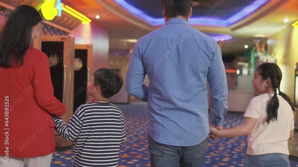 Asian family audiences come to movies when theater opens and cinema shows, enjoy walking together in the hall, public indoor entertainment lifestyle with film art shows, and happy and cheerful people. Asian family audiences come to movies when theater opens and cinema shows, enjoy walking together in the hall, public indoor entertainment lifestyle with film art shows, and happy and cheerful people.