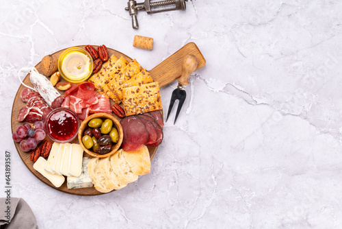 Antipasto board with prosciutto, salami, crackers, cheese