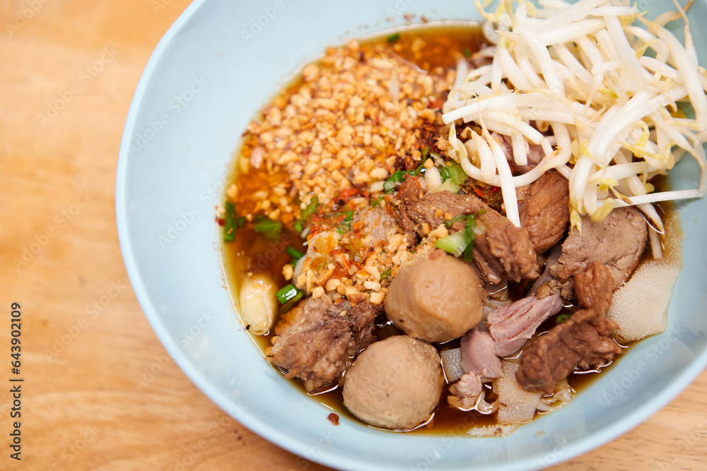Rice stick noodles with braised beef and meatball in a bowl Rice stick noodles with braised beef and meatball in a bowl