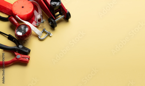 Car emergency kit on yellow background for vehicle and transportation concept photo