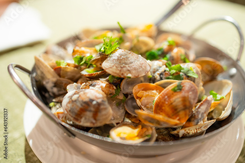 Grilled clam with lemon sauce dish