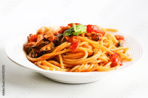 plate of seafood spaghetti with tomato