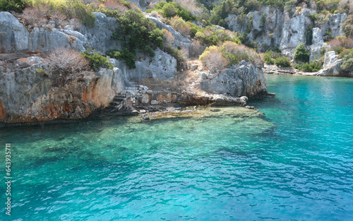 Kekova sunken city. Ruins of Lycian civilizations in the Mediterranean sea. Turquoise water. Antalya, Türkiye.