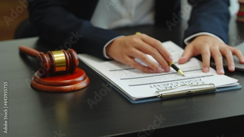 Legal consultant and real estate attorney lawyer read the building lease contract signing agreement for local business.