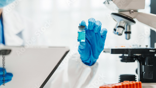 Close up scientist conducting precise virus lab test  scientific methodology  microbiologist conducting virus detection and testing in progress
