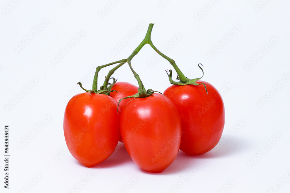 Bunch of red cherry tomatoes with a white background Bunch of red cherry tomatoes with a white background