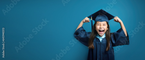 Kid in graduate dress with happy emotion photo