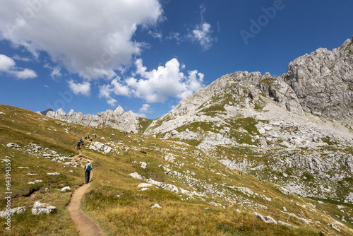 Durmitor National Park, hikers on the trail to Mount Bobotov Kuk. Beautiful panorama of Montenegro (Crna Gora) photo