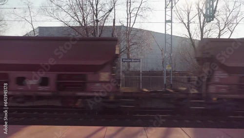 Train Stop in Wrocław, Poland - Captivating Urban Footage of Daily Commuters and Transportation #Wroclaw #Poland #TrainStop #UrbanLife #Transportation #PublicTransport #Cityscape #ExplorePoland #Commu photo