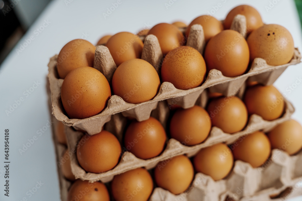 Farm fresh chicken eggs on paper egg box from organic farm., no people, nobody. Farm fresh chicken eggs on paper egg box from organic farm., no people, nobody.
