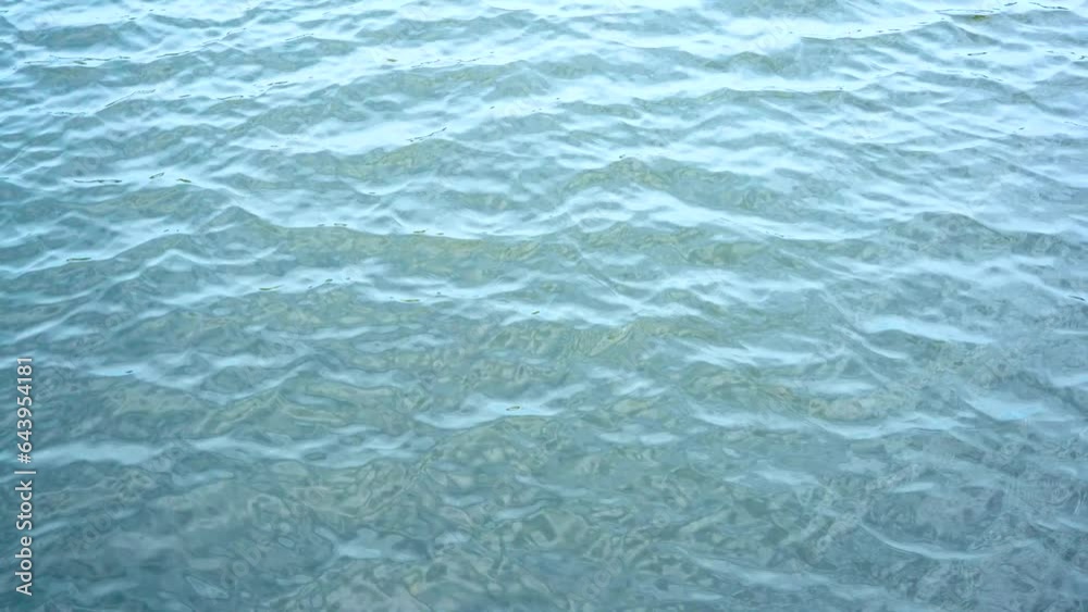 blue water waves and splashes surface in slow motion. blue water waves and splashes surface in slow motion.