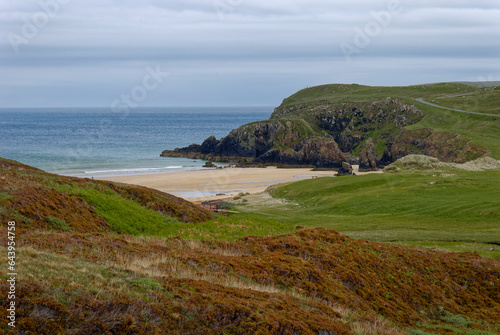 Garry Beach on the Isle of Lewis on an overcast morning in June with the tide heading out and the golden sands completely empty.