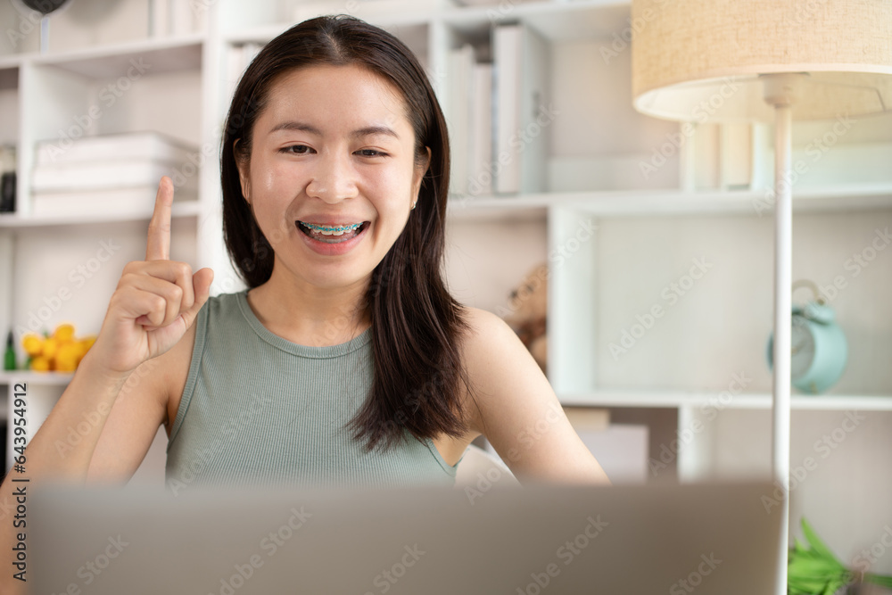 Young woman Working from Home, Video Call with Customer in Office, Remote Business Communication, Telecommuting Professional, Virtual Video Call with Office Customer, Work from Home Concept.