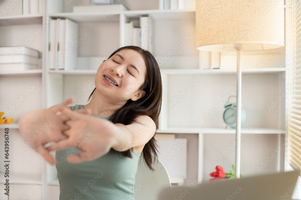 Young woman Relaxing After Work, Relaxed Young woman Unwinds, Stretch oneself. Young woman Relaxing After Work, Relaxed Young woman Unwinds, Stretch oneself.
