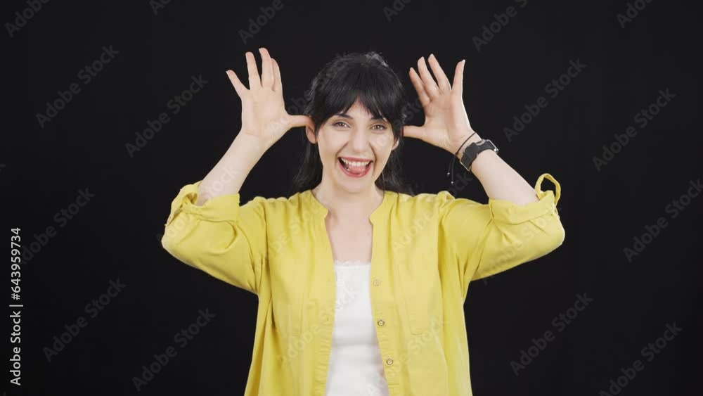 The woman making cute gestures for the camera. The woman making cute gestures for the camera.