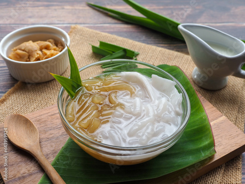 Pla Krim Khai Tao - Thai dessert of sweet rice noodles in palm sugar and in coconut cream at close up view