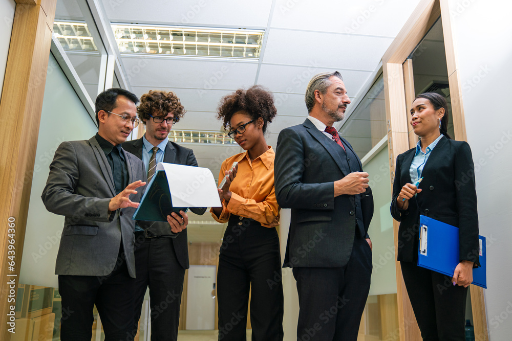 Professionals having a discussion, Successful business team working together in a co-working office Professionals having a discussion, Successful business team working together in a co-working office