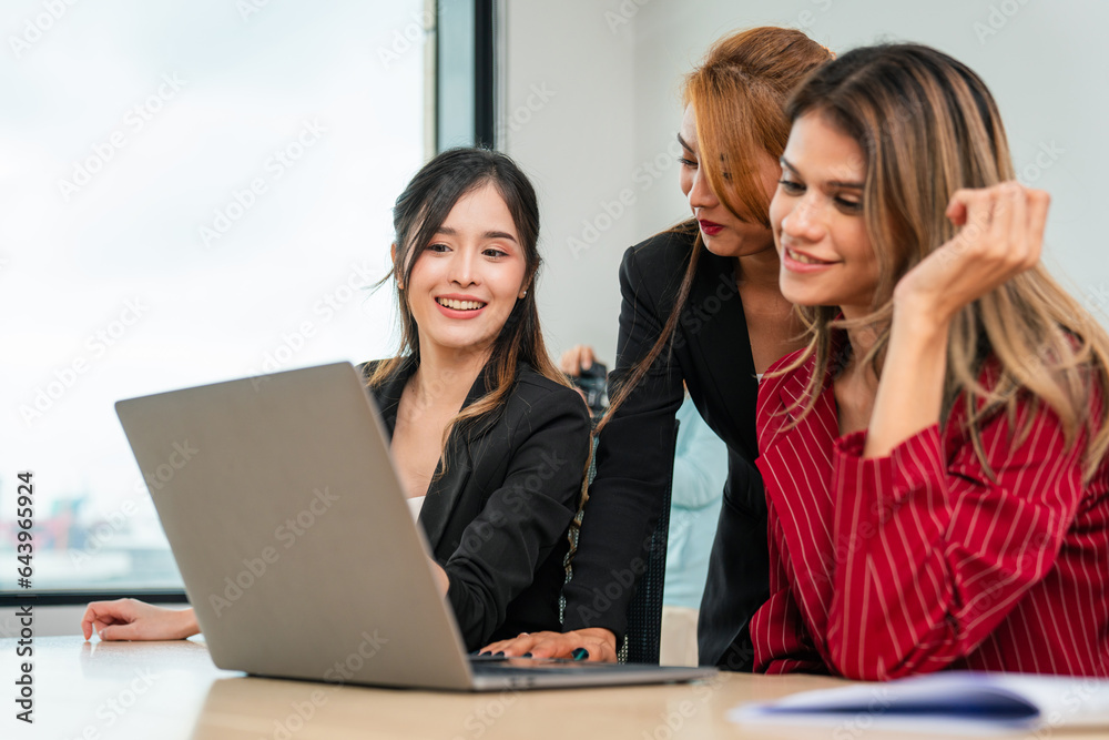 Successful business team working together in a co-working office. Successful business team working together in a co-working office.