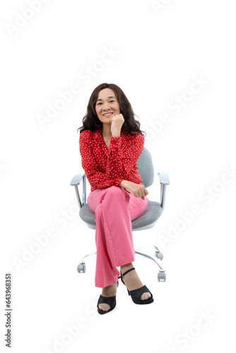 Young asian woman, professional entrepreneur standing in office clothing, smiling and looking confident, white background