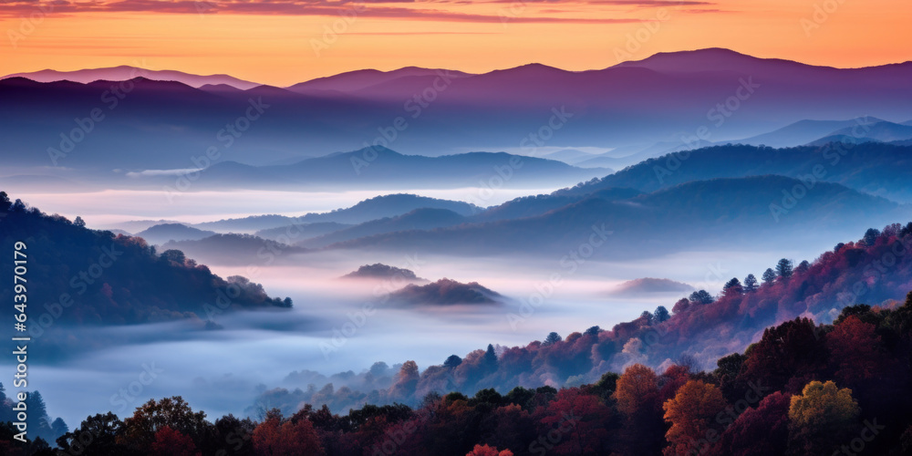 Obraz premium The mountains are shrouded in mist. A twilight shot of autumn mountains under a fading red orange purple sky.
