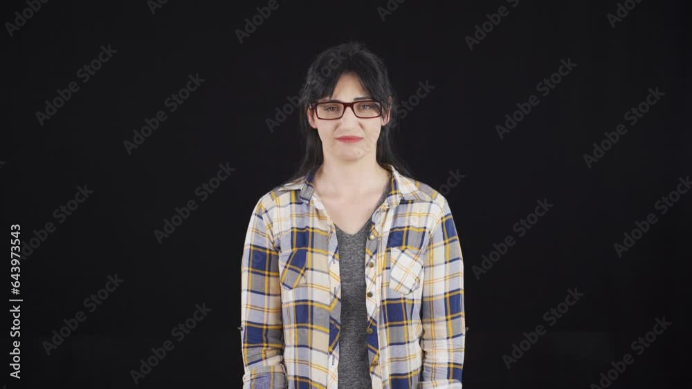 Woman with no vision problems throws glasses in trash. Woman with no vision problems throws glasses in trash.