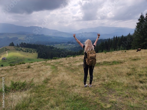 The girl conquered the mountain.