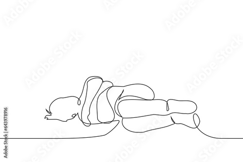 man lies hugging himself - one line art vector. the concept
