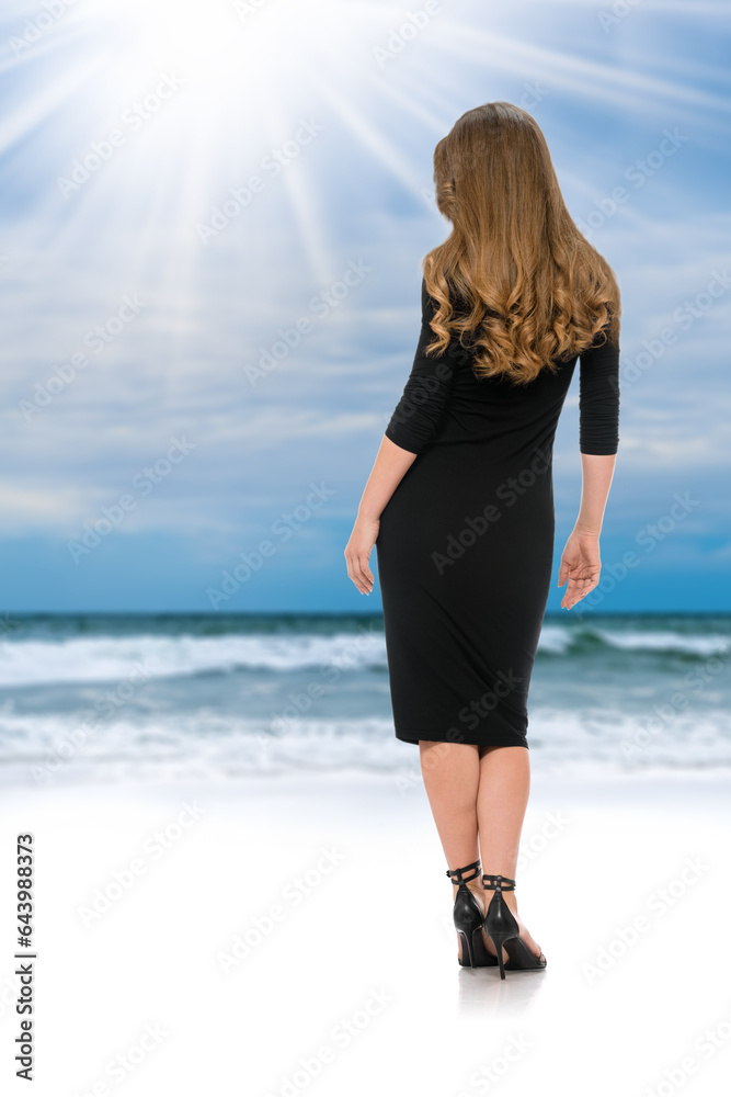 Back view of stunning blonde with wavy hair in long black dress and black heels over ocean background, Stunning back shot of a blonde bombshell in a tight black dress Back view of stunning blonde with wavy hair in long black dress and black heels over ocean background, Stunning back shot of a blonde bombshell in a tight black dress