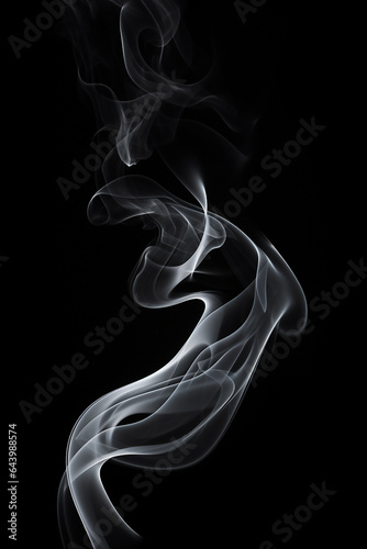 Detailed cigarette smoke on a black background. Soft curved texture.