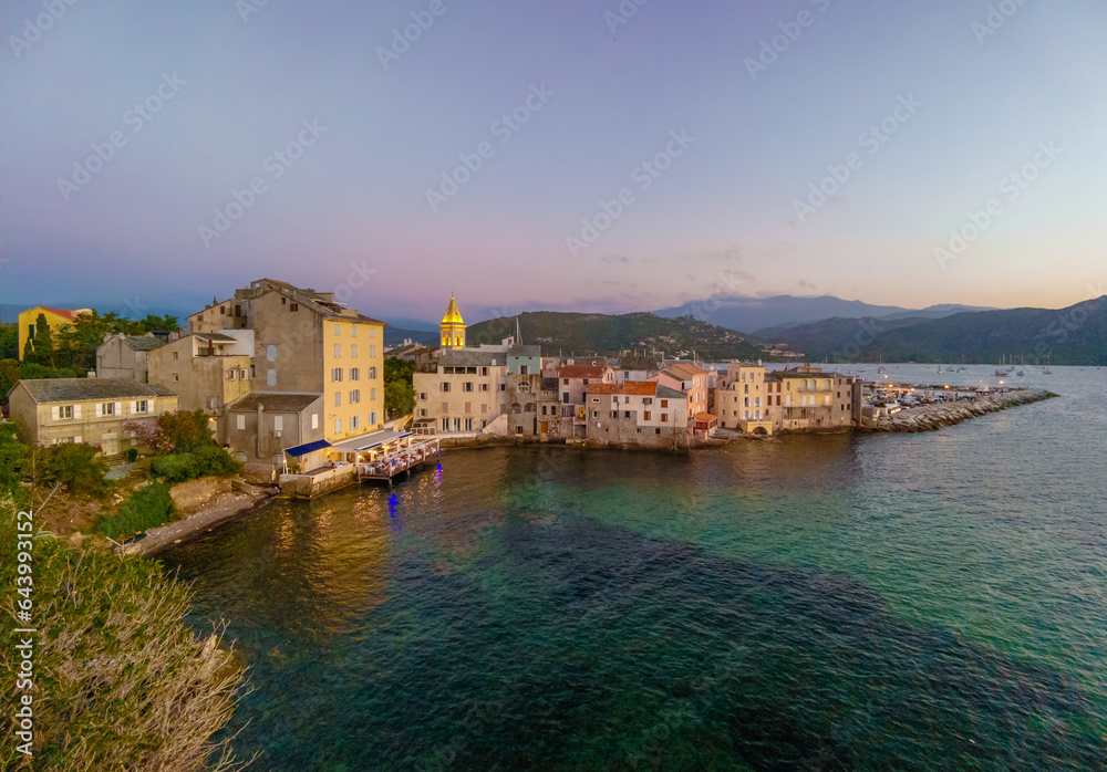Corse (France) - Corsica is a big touristic french island in Mediterranean Sea, with beautiful beachs and mountains. Here a view of the historical center of Saint Florent port village at sunset