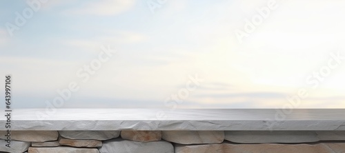 stone table in front of sea blur background with empty copy space on the table for product display mockup. Retro design montage presentation