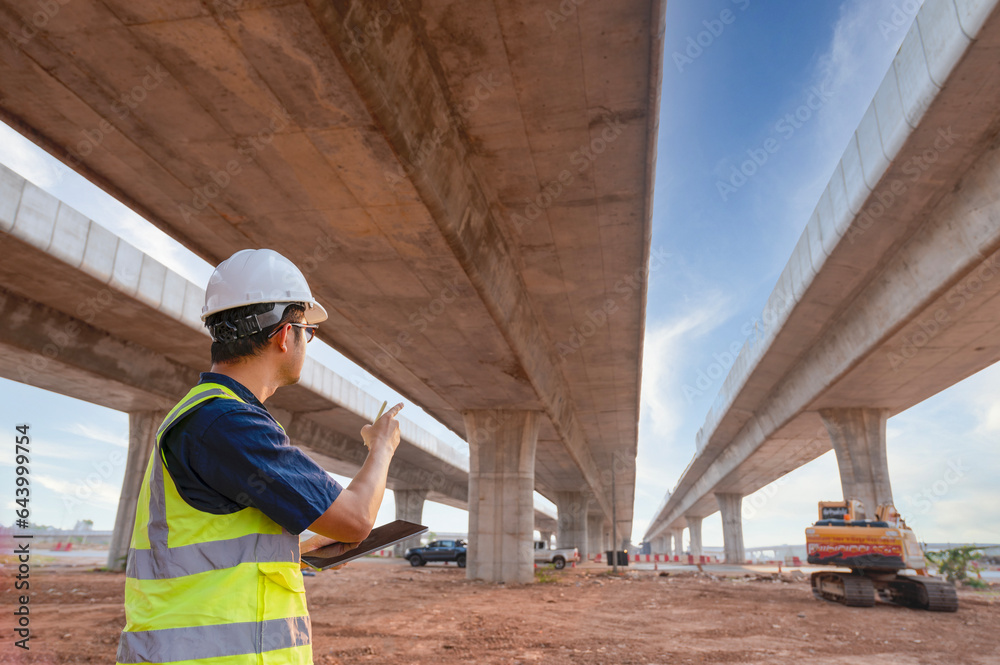 The chief civil engineer is introducing inspection of a road or expressway construction project under the road to an intern. At the expressway construction site The chief civil engineer is introducing inspection of a road or expressway construction project under the road to an intern. At the expressway construction site