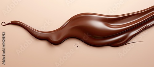Chocolate syrup droplet positioned against isolated pastel background Copy space