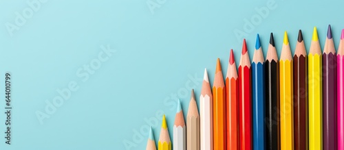 Close up view of colored pencils against a isolated pastel background Copy space