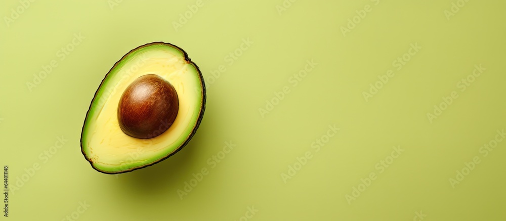Avocado half on a isolated pastel background Copy space