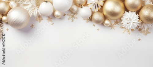 Gold and white Christmas decorations and frame mock up with New Years Christmas balls Winter holiday concept Flat lay with copy space isolated pastel background Copy space