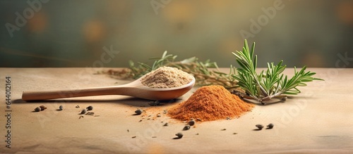 A spice container with a small spoon and flavorful herb for cooking with selective focus in some areas isolated pastel background Copy space
