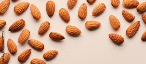 Almond nuts on isolated pastel background Copy space photo