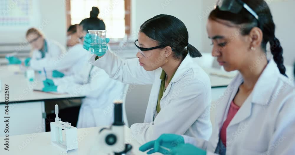 Woman, science classroom or college lab for learning, biology and study together for future development. Group, students and experiment with innovation, analysis and chemical at university laboratory Woman, science classroom or college lab for learning, biology and study together for future development. Group, students and experiment with innovation, analysis and chemical at university laboratory