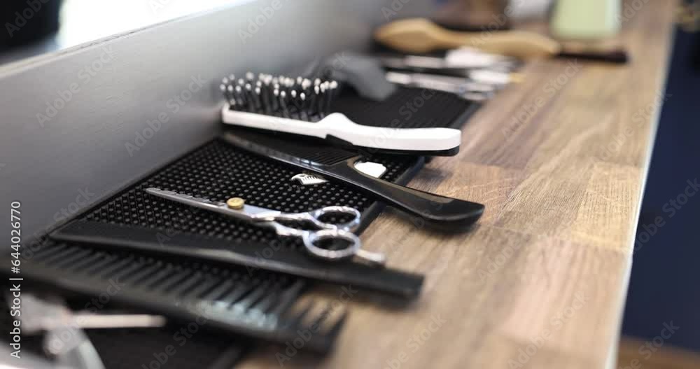 Barber tool set shiny steel scissors and comb ready to use. Beauty salon services
