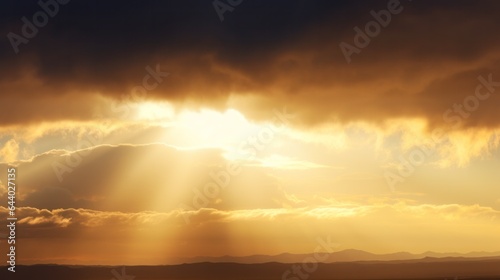 yellow rays of light shining through clouds