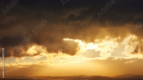 yellow light shining through clouds