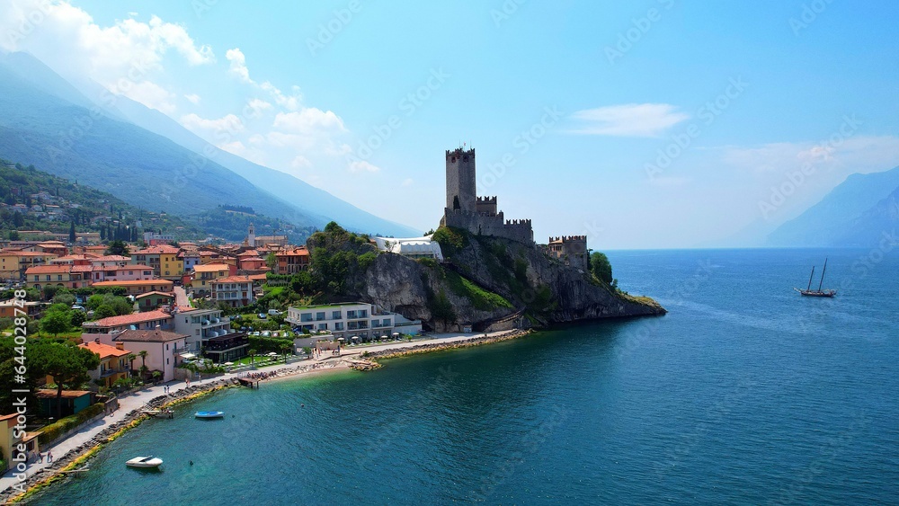 View of the Scaliger Castle from Malcesine - Lake Garda - 4k drone footage