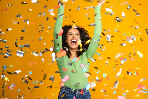 Photos Studio Shot Of Excited Woman Celebrating Big Win Showered In Tinsel Confetti On